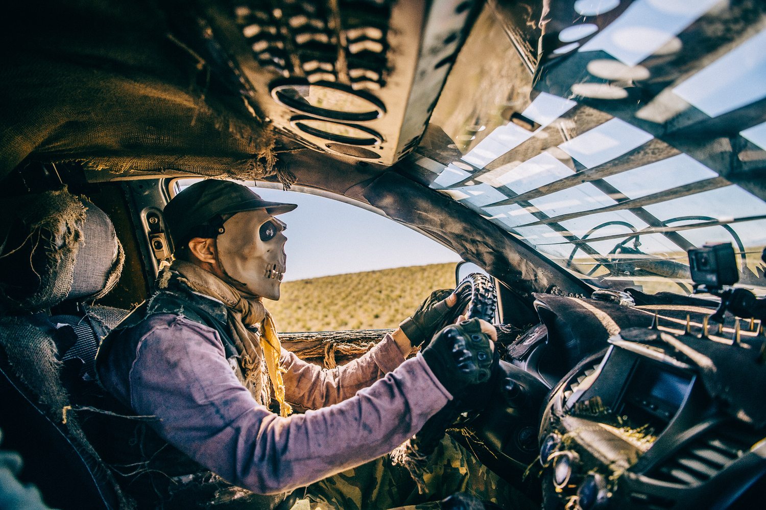 Alexey Gubarev at the wheel inside the cockpit of a MadWay Rally custom war-rig