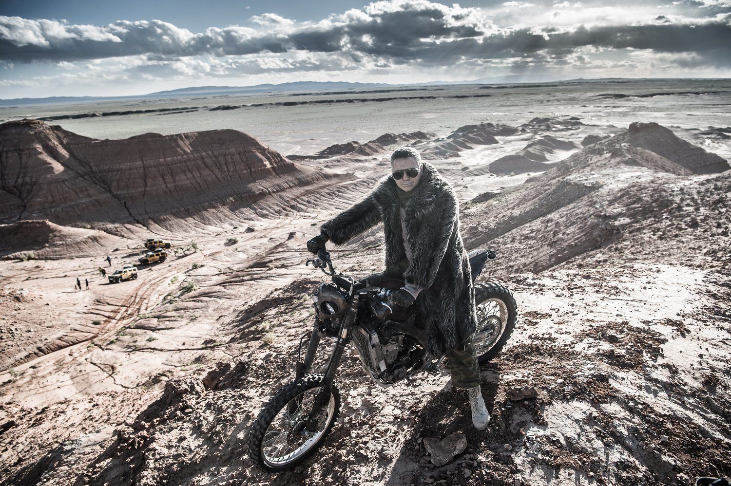 Alexey Gubarev on a motorcycle above a canyon during the MadWay Rally expedition