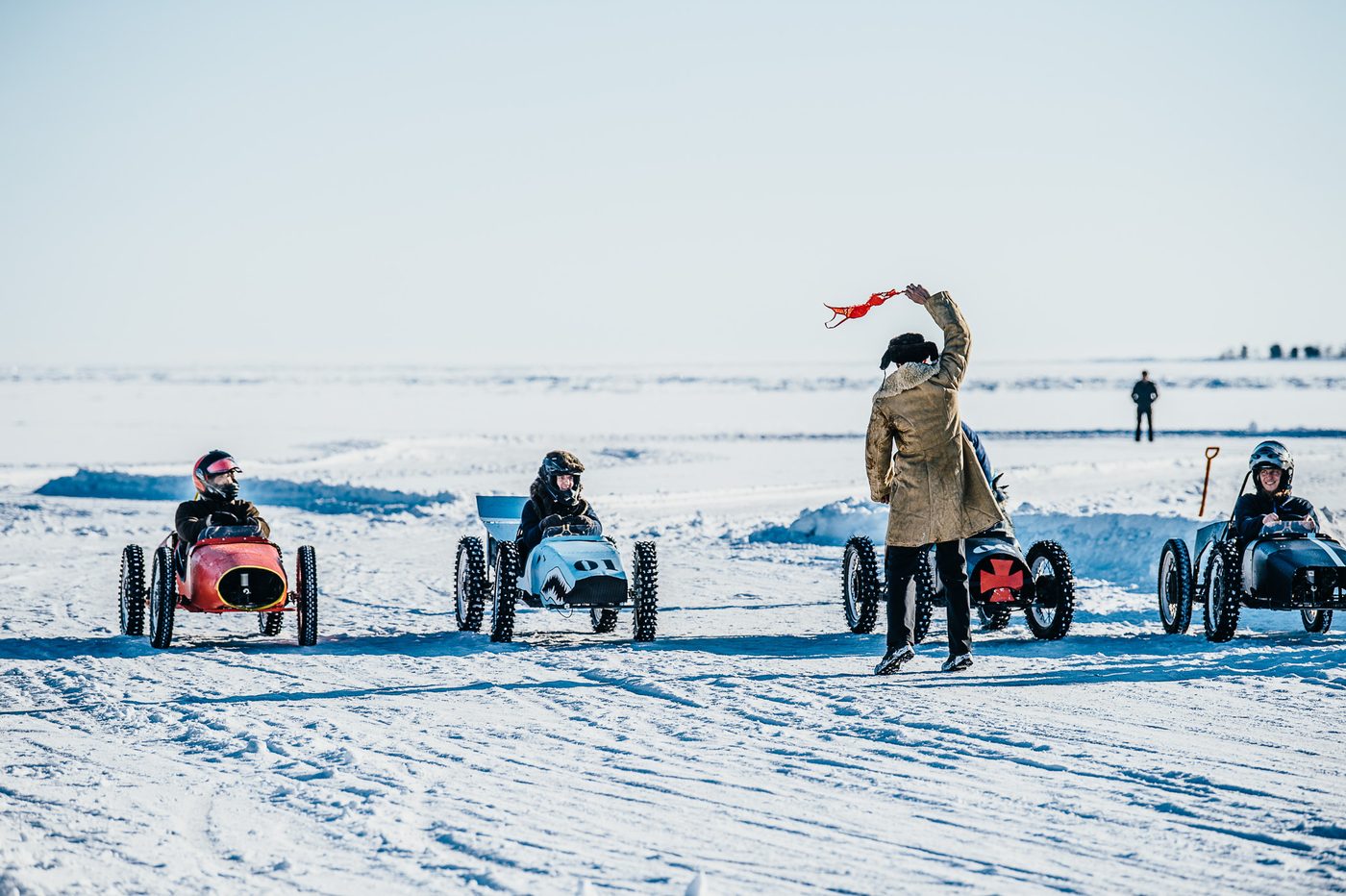 Snow karts of MadWay Rally lining up for the start on frozen Lake Baikal