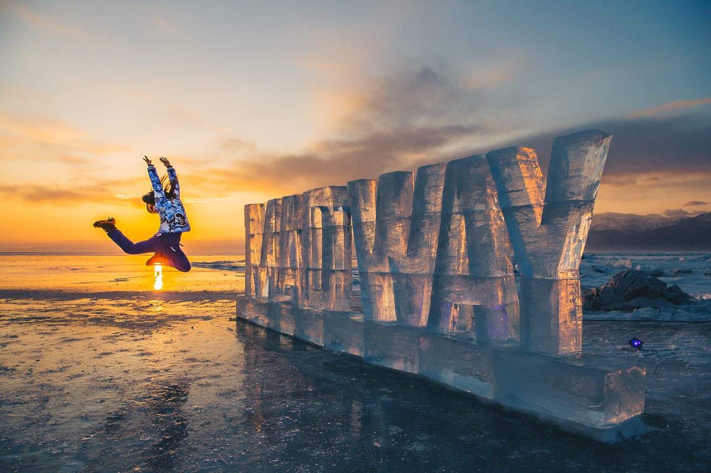 MADWAY letters installed on the ice of Lake Baikal at sunset