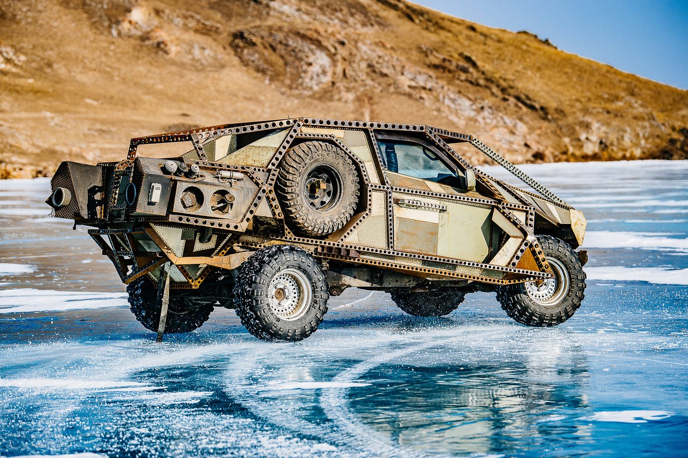 MadWay Rally spiked custom car standing on the ice of Lake Baikal