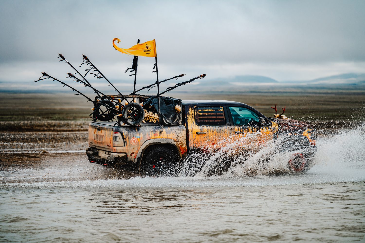 MadWay Rally pickup fording a braided river in the Tian Shan, China