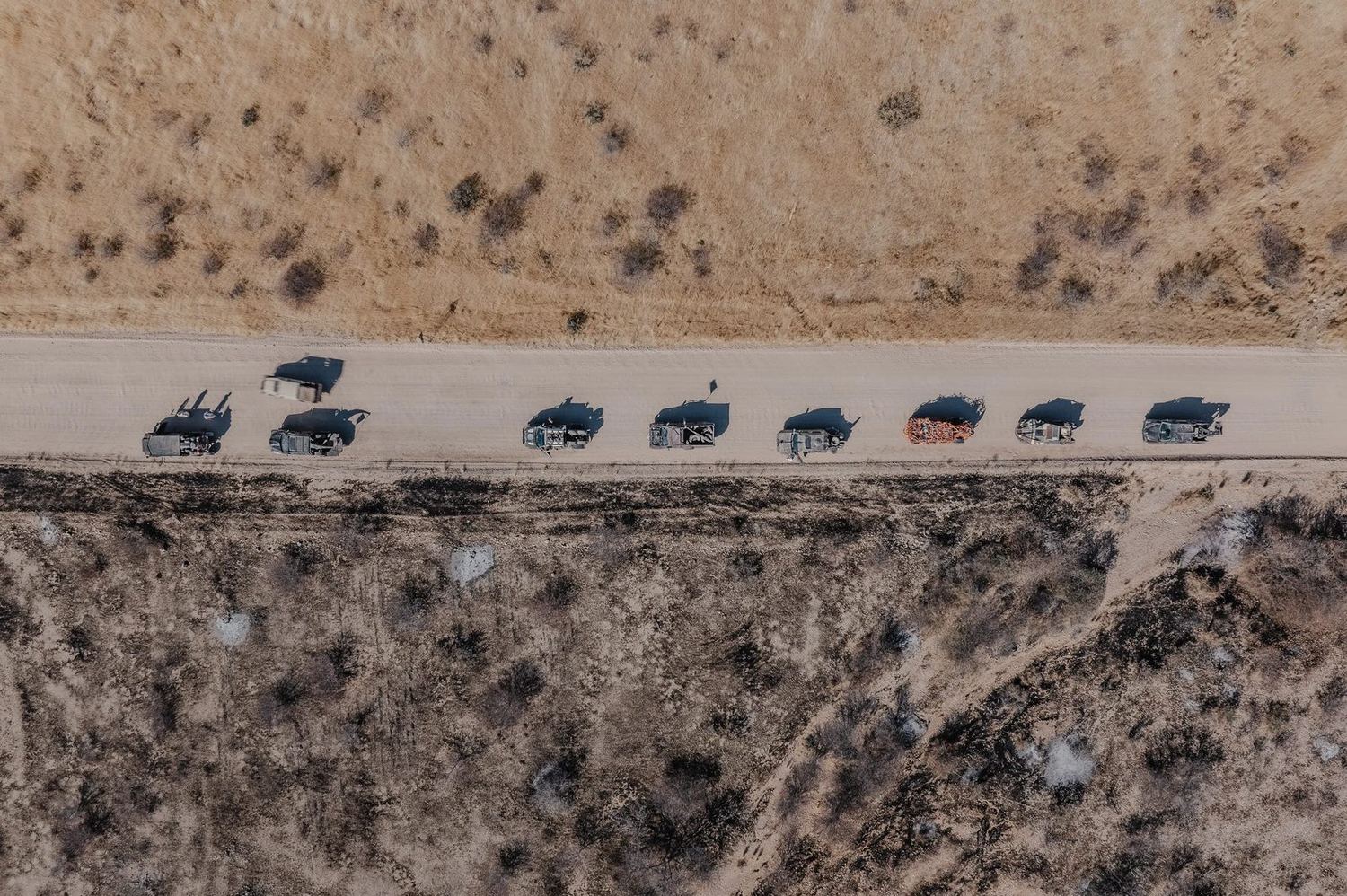 Aerial view of the MadWay Rally convoy in the mountains of Kyrgyzstan
