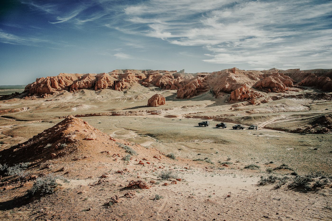 MadWay Rally vehicles among red rock canyons in Kyrgyzstan