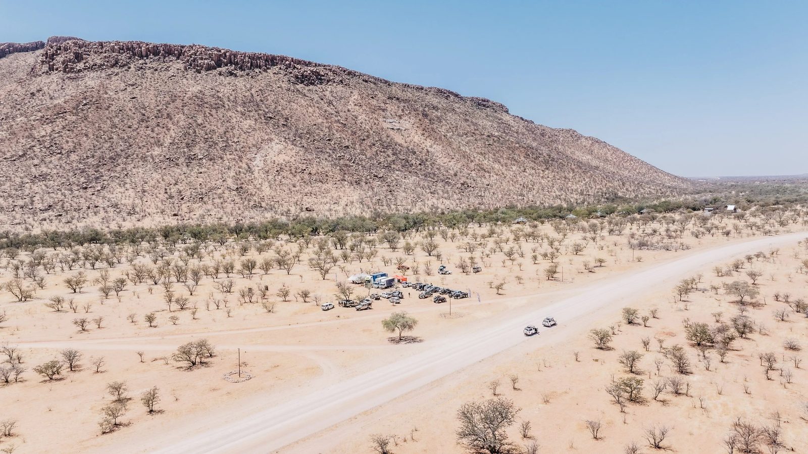 Vast desert landscape of the Gobi with the MadWay Rally convoy, Mongolia