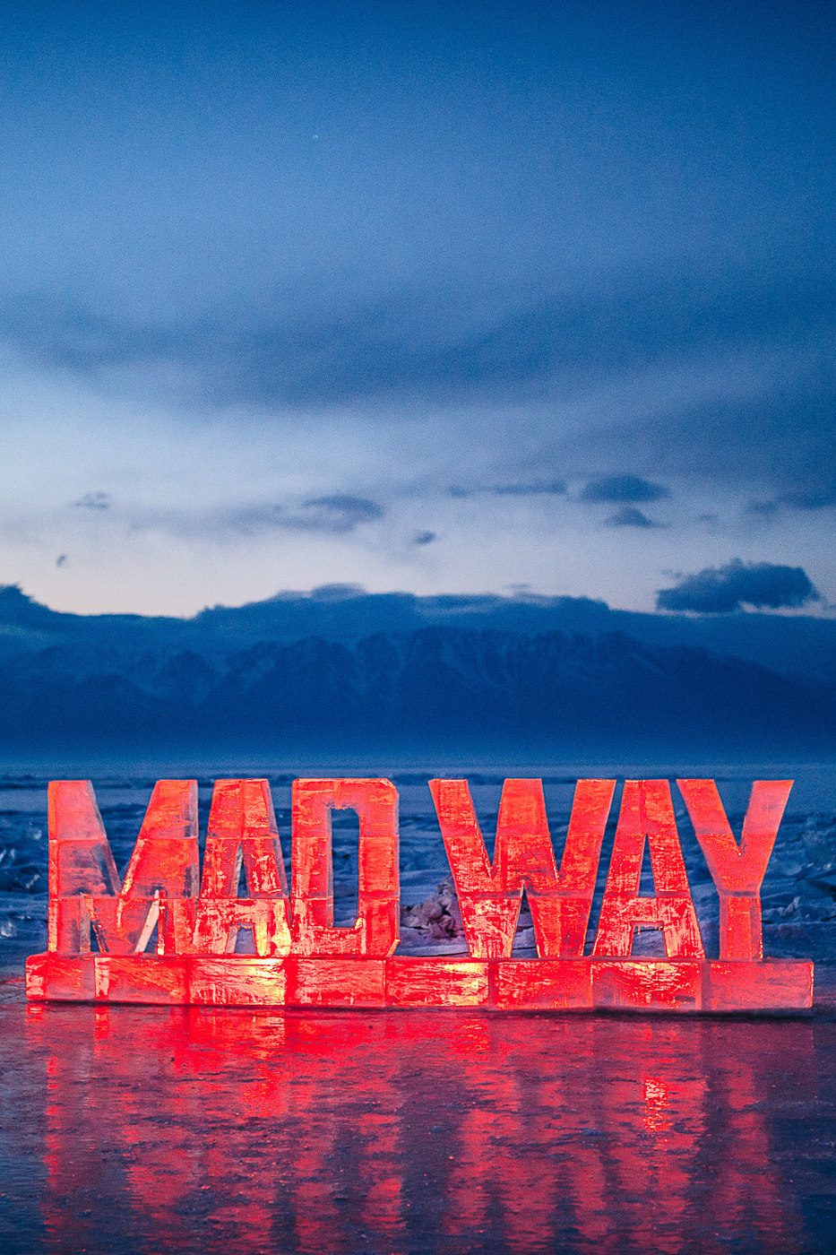 MADWAY neon sign glowing red in the night