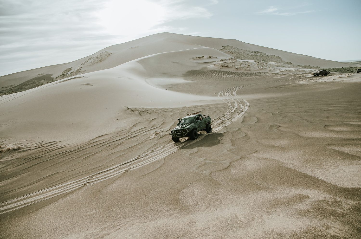 MadWay Rally buggy racing through the Gobi Desert dunes in Mongolia